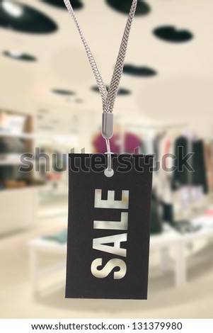 sale sign hanging in clothes shop