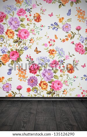 vintage room with floral colorful wallpaper and wooden floor
