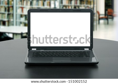 laptop with blank screen on the table in library