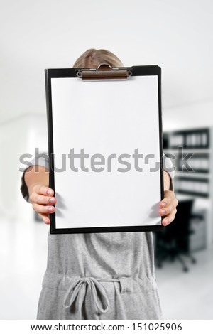 woman hold a blank clipboard in the office