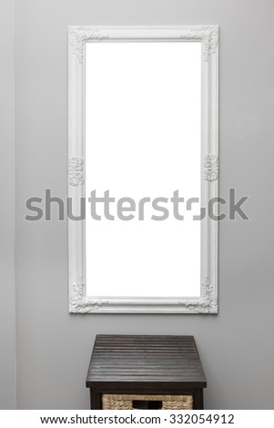 white vintage mirror frame on the gray wall