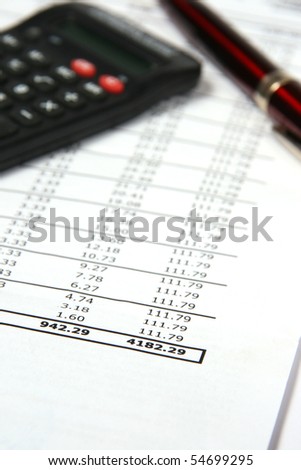 pen and calculator on bank credit document