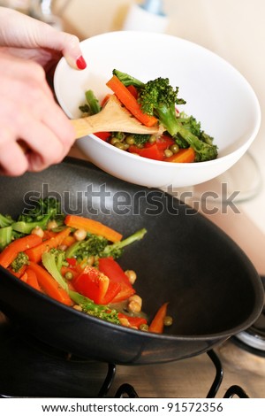 cooking vegetables in wok pan