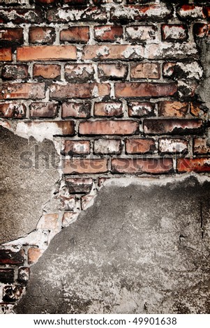 Grunge brick wall texture with concrete remains.