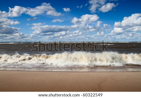 Baltic sea beach and blue summer sky
