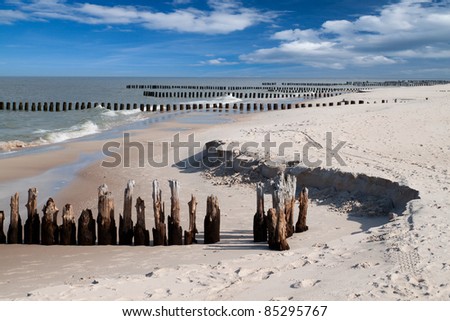 Wooden breakwaters at Baltic sea coast.