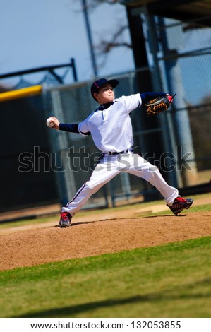 Baseball pitcher in white jersey