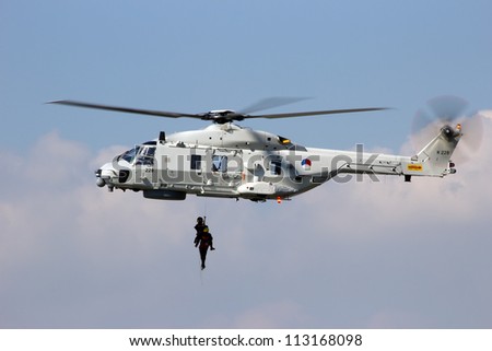 ROTTERDAM, HOLLAND - SEPTEMBER 8: Demonstration of a rescue operation by a Dutch Navy NH90 helicopter during the World Harbor Days in Rotterdam, Holland on September 8, 2012