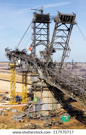 Assembling a huge coal mining excavator in a coal mine pit