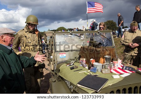 EDE, NETHERLANDS - SEP 22: US Army material and visitors during the Market Garden memorial on Sep 22, 2012 near Ede, Netherlands. Market Garden was a large Allied military operation in September 1944