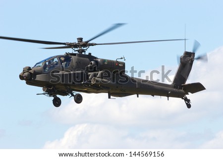 VOLKEL, NETHERLANDS - JUNE 14: Dutch Air Force AH-64 Apache performing at the Royal Netherlands Air Force Days June 14, 2013 in Volkel, Netherlands.