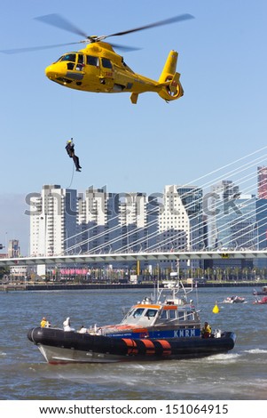 ROTTERDAM, HOLLAND - SEPTEMBER 8: Demonstration of a rescue operation by with a helicopter during the World Harbor Days in Rotterdam, Holland on September 8, 2012