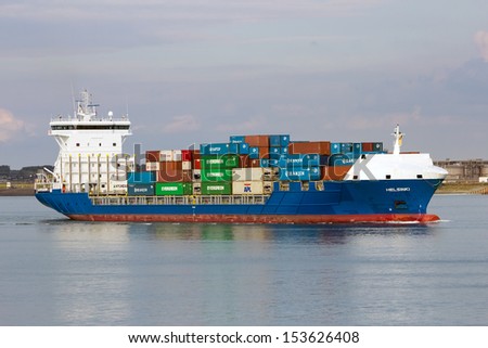 ROTTERDAM, NETHERLANDS - SEP 8: Container ship leaving the Port of Rotterdam on Sep 8,2013 in Rotterdam, Netherlands. The port area is 105 square km and the largest port in Europe.