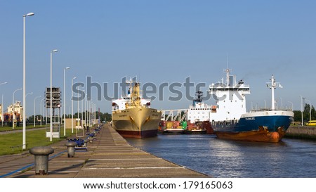 ROTTERDAM - JULY 9: Ships waiting in a lock sluice to leave the Port of Rotterdam on July 9, 2012. Rotterdam is with it\'s 105 square km the largest port in Europe.