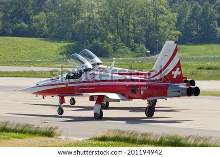 BERLIN, GERMANY - MAY 22: Patrouille Suisse F-5 fighter jets about to take off at the International Aerospace Exhibition ILA on May 22nd, 2014 in Berlin, Germany.
