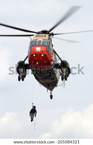 GILZE-RIJEN, THE NETHERLANDS - JUNE 20: Belgian Navy Sea King rescue helicopter performing at the Dutch Air Force Open Day on June 20, 2014 in Gilze Rijen, The Netherlands