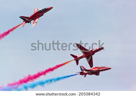 VOLKEL, NETHERLANDS - JUNE 14: RAF Red Arrows performing at the Royal Netherlands Air Force Days June 14, 2013 in Volkel, Netherlands.