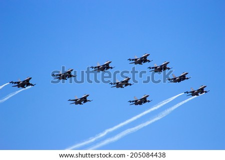 VOLKEL, THE NETHERLANDS - JUNE 15: Dutch Air Force F-16 formation flyby at the Dutch Air Force Open Day on June 15, 2013 in Volkel, The Netherlands