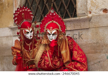 VENICE - FEBRUARY 5: Costumed couple on the Piazza San Marco during Venice Carnival on February 6, 2013 in Venice, Italy. This year the Carnival was held between January 26 - February 12.