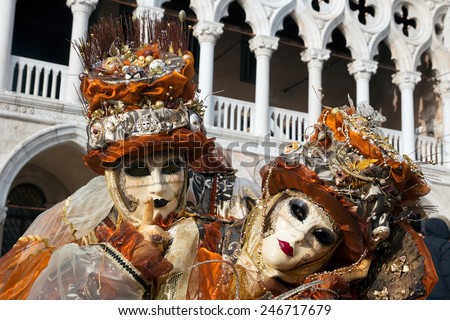Costumed couple on the San Marco square during Carnival in Venice