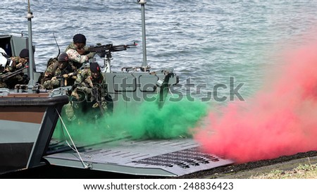 DEN HELDER, THE NETHERLANDS - JULY 7: Dutch Marines in a Landing craft during an amphibious assault demo during the Dutch Navy Days on July 7, 2012 in Den Helder, The Netherlands