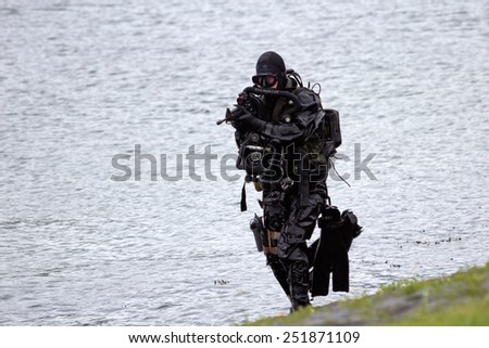 DEN HELDER, THE NETHERLANDS - JUNE 23: Dutch Special Forces combat diver during an amphibious assault demo during the Dutch Navy Days on June 23, 2013 in Den Helder, The Netherlands