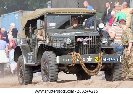EDE, NETHERLANDS - SEP 20, 2014: Dodge WC-56 Command Car in a parade during the Market Garden Memorial. Operation Market Garden was a large Allied military operation in September 1944.