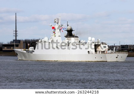 ROTTERDAM - JAN 30, 2015: Chinese PLA Navy multi-role frigate Yuncheng (571) is leaving the Port of Rotterdam after the first visit ever of the Chinese PLA Navy to The Netherlands.