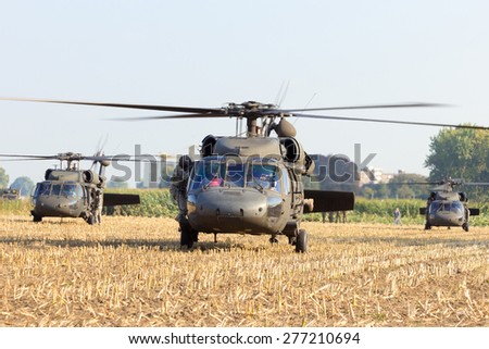 GRAVE, NETHERLANDS - SEP 17: American Black Hawk helicopters in a field at the Operation Market Garden memorial on Sep 17, 2014 Grave, Netherlands. Market Garden was a large Allied operation in 1944.