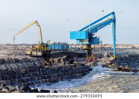 ROTTERDAM - JAN 13, 2012: Construction of a new harbor in sea, Maasvlakte 2, in the Port of Rotterdam. It\'s Europ\'s largest port and facilitate the needs of a hinterland with 40,000,000 consumers.