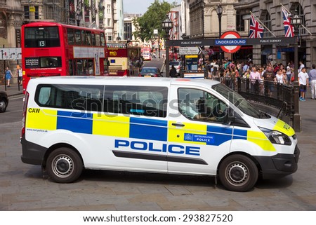 LONDON - JUL 1, 2015: London Metropolitan Police van at Piccadilly Circus. The Metropolitan Police was formed in 1829 and as of 2011 employed 48,661 staff making it one of biggest employer in London.