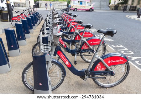 LONDON - APR 6, 2015: Row of rental bikes from Santander Cycles. Santander Cycles is London's self-service, bike-sharing scheme for short journeys.