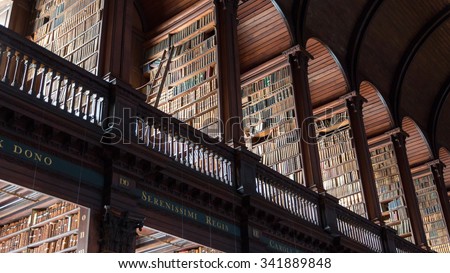 DUBLIN, IRELAND - FEB 15, 2014: The Long Room library in the Trinity College. Trinity College Library is the largest library in Ireland and home to The Book of Kells.