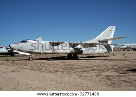 Old military plane in an aircraft graveyard in the desert