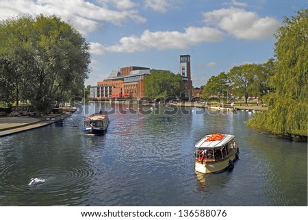 The river at Stratford on Avon is a popular leisure facility, and on the far side can be seen the Royal Shakespeare Theatre.