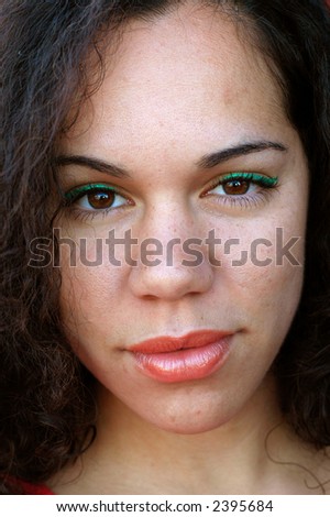 Stunning portrait of a young woman.  Simple, clean, with great complexion.