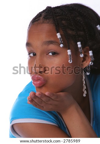 stock photo Young preeteen acting cute by blowing a kiss at the camera