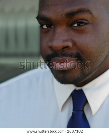 Young ad very good looking African American businessman