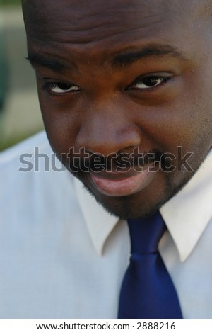 Sexy African American businessman with a bit of a smirk on his face