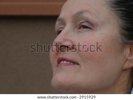 Older woman looking forward, with copy space