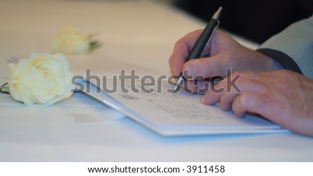 Older gentleman singing the guestbook at a wedding reception