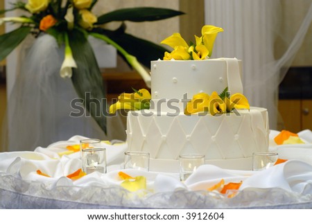 stock photo Elegant wedding cake with tea candles and rose petals