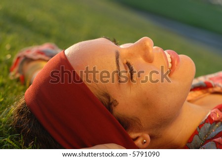Free spirited young woman enjoying a moment of peace in the park