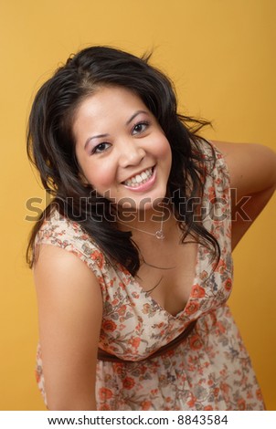Cute, young Asian American woman having fun