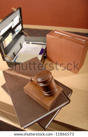 Busy lawyer\'s desk with scattered books and papers