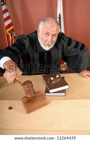 Grumpy old judge ruling during a trial in his courtroom