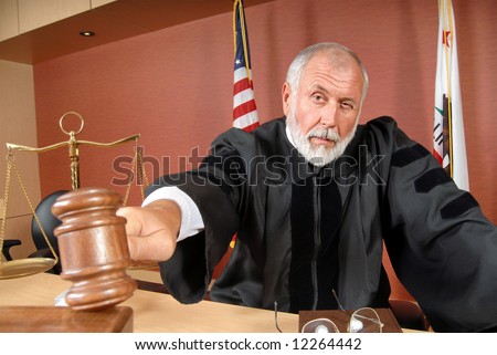 Older, distinguished judge making his ruling in the courtroom