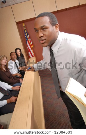 Passionate attorney making a speech in front of the jury box