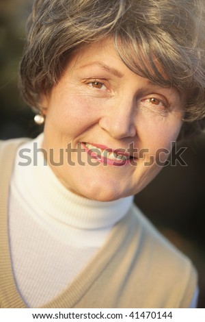 Soft and luminous portrait of a beautiful older lady