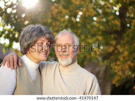Senior couple outside on a sunny fall day
